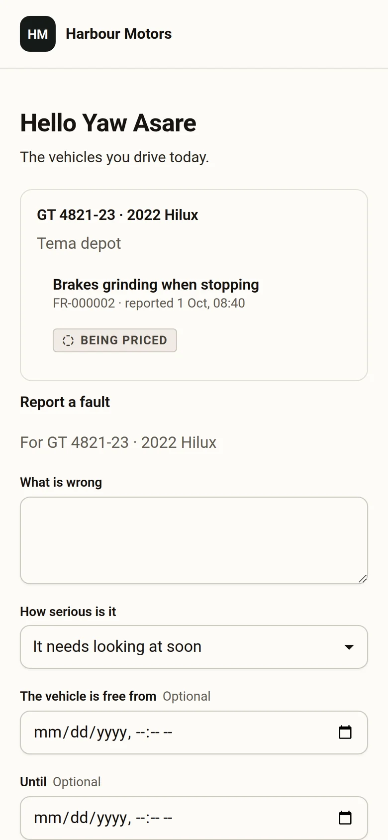 A driver's phone showing the vehicle they drive, a fault they reported, and a note that it was sent to the dealership